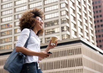Happy young woman listening to the music