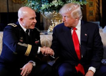 Donald Trump congratulating  Mcmaster. photocredit. THE GUARDIAN.COM