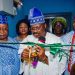 Senator Ajimobi  cutting the tape , flanked by Magida and Onpetu of Ijeru, Oba Oladapo Oyediran.  Photo Source. Tolani Alli