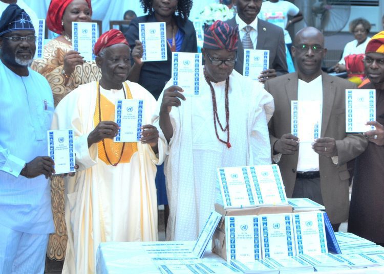 DSC_2990 - National Insight News L-R: The Oyo State Commissioner of Information, Culture and Tourism, Mr. Toye Arulogun, Chairman of the Occasion, Chief Bamiji Ojo, the Otun Olubadan of Ibadanland, Oba Lekan Balogun, the Director, United Nations Information Centre (UNIC), Mr. Roland Kayanja and the Special Adviser to Governor Ajimobi of Sustainable Development Goals (SDGs), Engr. Tope Fajana during the launch of SDGs goals to Yoruba translated document held at Mapo hall, Ibadan on Wednesday.
