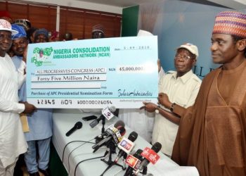 NCAN  leaders presenting the cheque to Chairman of the All Progressives Congress (APC), Comrade Adams Oshiomhole, in Abuja.