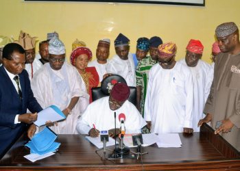 Ekiti State Governor, Dr Kayode Fayemi signing the 2019 Budget , surrounded by members of the State Assembly and state executive Council, at the Executive Chamber, Governor's office, Ado-Ekit...on Thursday