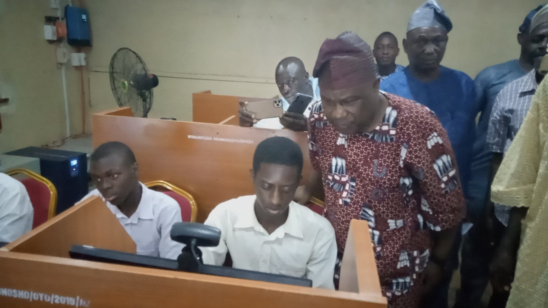 Senator Buhari inspecting a student on computer at Anglican Grammar School Ogbomoso