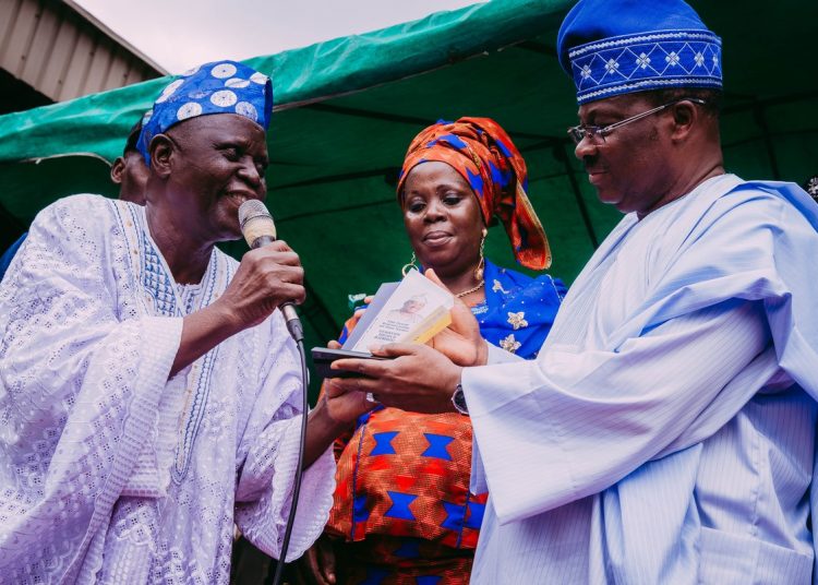 L-R: President, National Association of Patent and Proprietary Medicine Vendors, Alhaji Abiodun Ashiru; Ona Ara Local Government Chairperson of the association, Mrs. Romoke Olaniyi; and Oyo State Governor, Senator Abiola Ajimobi, during the conferment of "The great visionary leader"' award on him by the federation, in Ibadan... on Thursday. Photo: Governor's Office