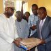 The Secretary to the Oyo State Government, Mr. Olalekan Alli receiving the project documents at the handing over of buildings donated by CBN to TechU, Ibadan from the CBN Branch Controller, Lagos Branch, Mr. Omebere Iyari on Thursday in Ibadan.