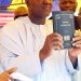 Speaker Yakubu Dogara  
 holding the bible written in Tera Language Bible in Yamaltu Deba, Gombe state."