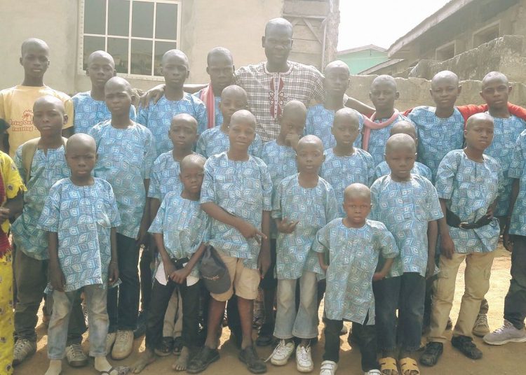 Oriyomi Hamzat poses with some of the kids in his charity home. photo source; https://web.facebook.com/oriyomi.hamzat.7/photos_all