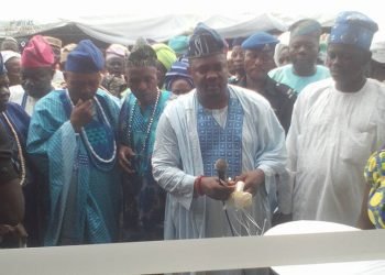 Hon Sugar cutting the tape at the commissioning