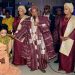 His Imperial Majesty Oba Lamidi Olayiwola Adeyemi flanked by two olori  praying for Lizzy Anjorin