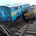 Two Indian passenger trains lay next to each other following a derailment after they were hit by flash floods on a bridge outside the town of Harda in Madhya Pradesh state on August 5, 2015. Two passenger trains derailed after being hit by flash floods on a bridge in central India, killing at least 27 people in the latest deadly accident on the nation's crumbling rail network. AFP PHOTO        (Photo credit should read STR/AFP/Getty Images)