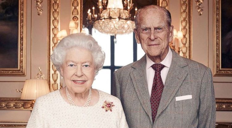 Britain's Queen Elizabeth and Prince Philip pose for a photograph in the White Drawing Room at Windsor Castle, England in this handout photo issued Nov. 18, 2017, in celebration of their platinum wedding anniversary Nov. 20, 2017.