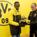 Bolt receives his training gear from Borussia Dortmund kit manager Frank Graefen.  credict. Skuysports.com