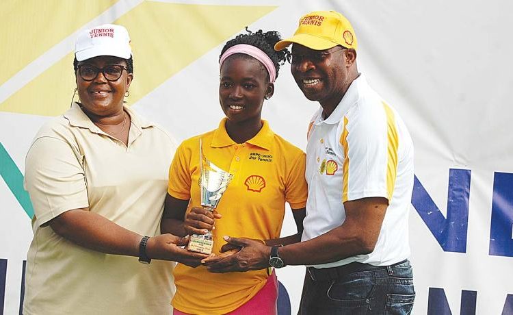 Winner, Girls 16 & MOP, Omolayo Bamidele (middle) receiving from her trophy from Ogunjoye (left) and Ikhanna Mborah of the Sports Ministry at the end of the SNEPco Junior Tennis Championship in Lagos…at the weekend.