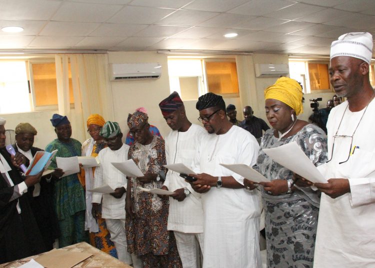 R-L: Oyo State Secretary of the All Progressives Congress, Hon. Mojeed Olaoya; Woman Leader, Mrs. Mabel Williams; Vice Chairman, Oyo South, Mr. Adefisoye Adekanye, and others during the inauguration of the state executive members of the APC, at the party's secretariat, Ibadan... on Thursday
