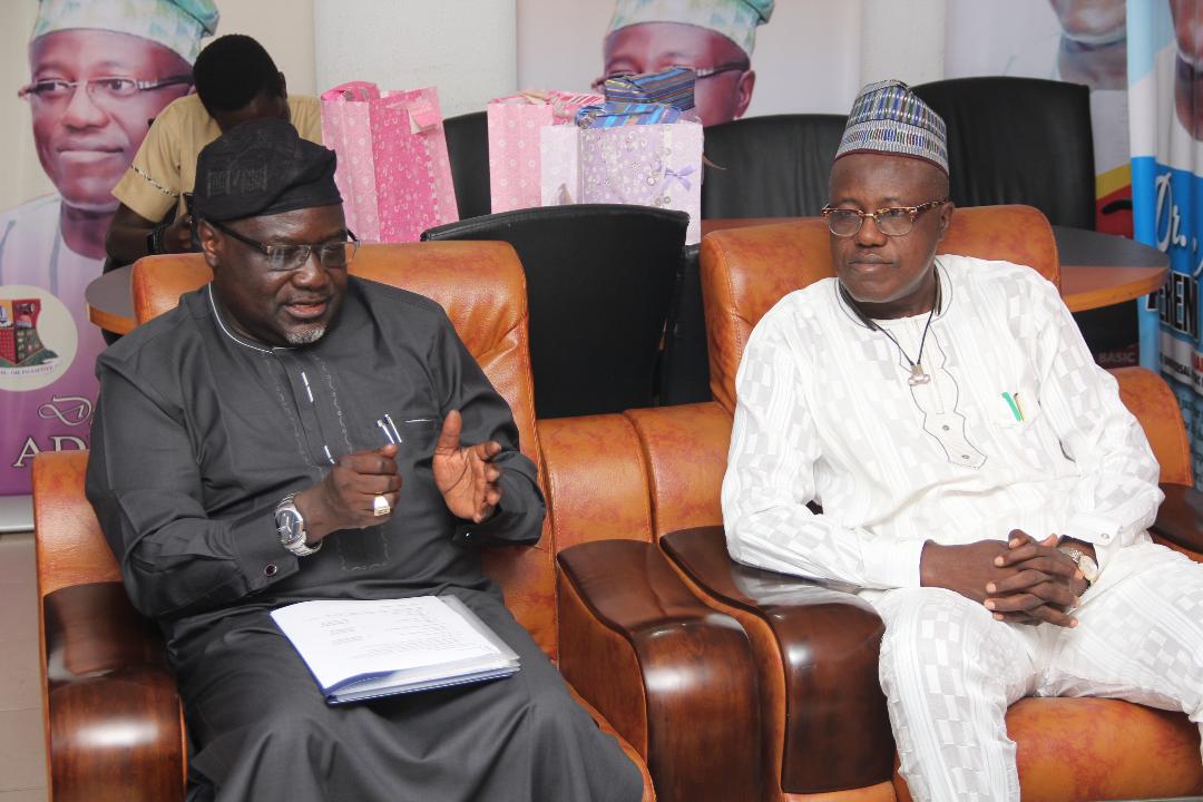 Chairman, Oyo State Universal Basic Education Board, OyoSUBEB, Dr. Nureni Adeniran (right) listening to the Director, Admin and Supply, Universal Basic Education Board,  Rt. Rev. Edwin Jarumai during the Commission's Advocacy visit to the State.