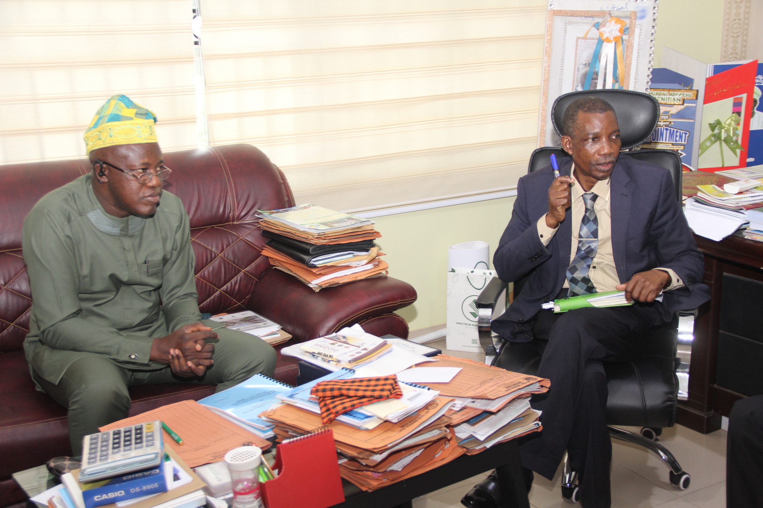 Dr. Nureni Adeniran (left) while receiving the Commissioner of Health, Dr. Bashir Bello (right) in his office today