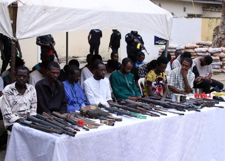 suspects paraded by police