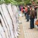 Parents looking at advertisement | Image: MatjazTancic for The WorldPost