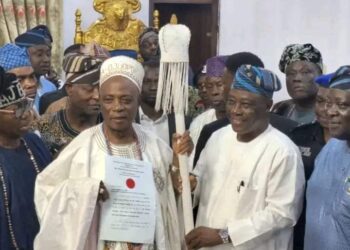 Oyo state Deputy Governor Bar. Bayo Lawal Presenting Instrument of Office to Sen Rasidi Ladoja