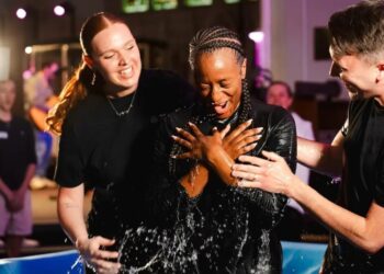 DJ cuppy being baptized