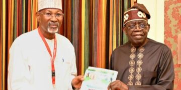 Prof. Jega submitting the Livestock Reforms Committee’s report to President Tinubu