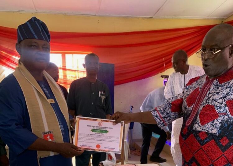 Re-elected president of
 Ibadan Christ Apostolic Grammar School Old Boys Association (ICAGSOBA) receiving certificate of returns