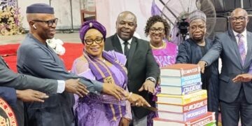 Left to Right Dr Olusegun Mimiko, Prof Lilian Salami, VC, UNIBEN and other principal officers of the University cutting the 54th Anniversary Cake