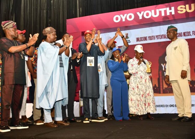 Oyo State Governor, Seyi Makinde (right) receiving Lifetime Achievement award from Group Managing Director of BOVAS Group, Dr Victoria Samson (second right); while Commissioner for Youth and Sports, Hon Wasilat Adegoke (left) and Secretary, Oyo Youth Summit Planing Committee, Prince Deji Adeyemo look on, during 2025 Oyo State Youth Summit, held at International Conference Centre, University of Ibadan. PHOTO: Oyo Gov's Media Unit.