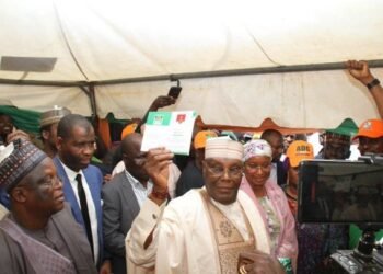 Ex VP Atiku Abubakar displaying his Card after registration as ADC member