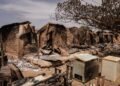 A general views of burnt debris and damaged homes following the attack in Woro, Kwara State, on February 5, 2026. Details are still emerging from the attack in Kwara State, but it is one of the country's deadliest in recent months. According to the Red Cross, the death toll stands at 162 people, and the search for bodies is ongoing. (Photo by Light Oriye Tamunotonye / AFP)