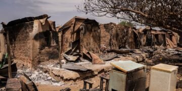 A general views of burnt debris and damaged homes following the attack in Woro, Kwara State, on February 5, 2026. Details are still emerging from the attack in Kwara State, but it is one of the country's deadliest in recent months. According to the Red Cross, the death toll stands at 162 people, and the search for bodies is ongoing. (Photo by Light Oriye Tamunotonye / AFP)
