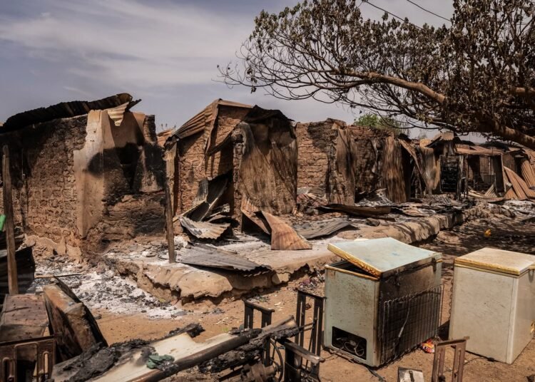 A general views of burnt debris and damaged homes following the attack in Woro, Kwara State, on February 5, 2026. Details are still emerging from the attack in Kwara State, but it is one of the country's deadliest in recent months. According to the Red Cross, the death toll stands at 162 people, and the search for bodies is ongoing. (Photo by Light Oriye Tamunotonye / AFP)