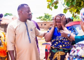 Adegbite consoling one of the victim's relative